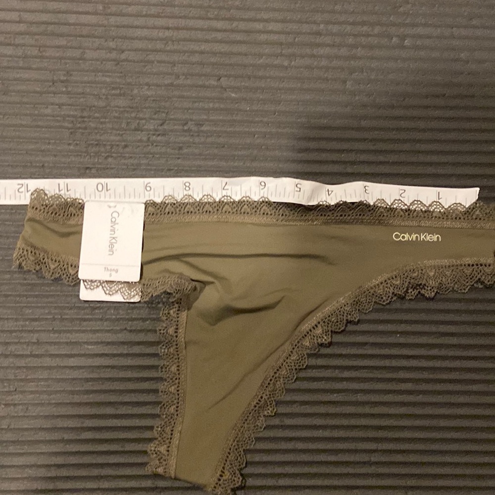 Never worn Calvin Klein green satin and lace undies